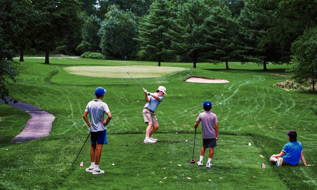 waiting for your turn on the golf course, young golfers